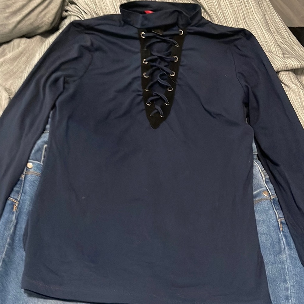 A blue stretchy sleeve shirt with cleavage holes to bring out a more sexy look